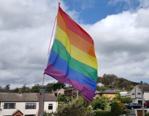 Pride flag flying over our offices